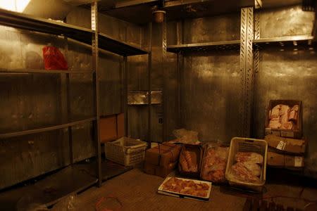 Meat is seen in the galley of the New Imperial Star casino cruiser at Victoria Harbour in Hong Kong, China April 15, 2016. REUTERS/Bobby Yip/File Photo