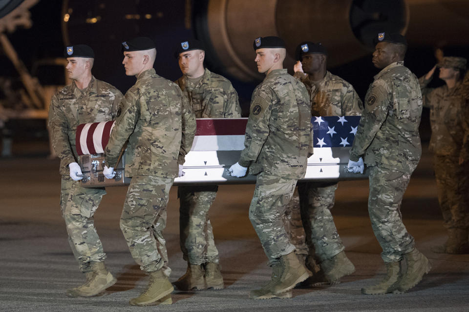 An Army carry team moves a transfer case containing the remains of Sgt. 1st Class Elis Barreto Ortiz, 34, from Morovis, Puerto Rico, Saturday, Sept. 7, 2019, at Dover Air Force Base, Del. According to the Department of Defense, Ortiz was killed in action Sept. 5, when a vehicle-borne improvised explosive device detonated near his vehicle in Kabul, Afghanistan. Ortiz was supporting Operation Freedom's Sentinel. (AP Photo/Cliff Owen)