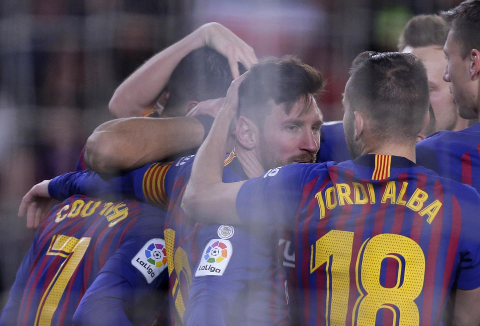 FC Barcelona's Lionel Messi, center, celebrates a goal with teammates during a Spanish Copa del Rey soccer match between FC Barcelona and Sevilla at the Camp Nou stadium in Barcelona, Spain, Wednesday, Jan. 30, 2019. (AP Photo/Manu Fernandez)