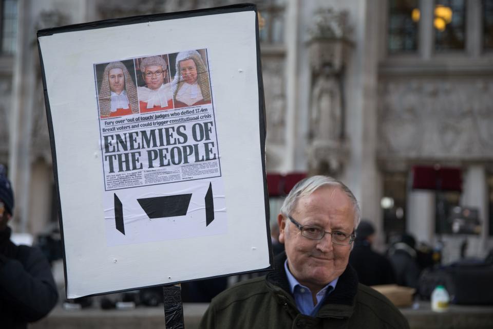 The front page used on this man’s placard has been singled out for criticism by a European Commissioner (Getty)