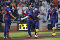 From left to right, Houston Astros' Kyle Tucker, Yainer Diaz, Jose Altuve and Maurico Dubon celebrate after Diaz, Dubon and Altuve scored on a three-run home run by Altuve against the Los Angeles Angels during the second inning of a baseball game Monday, May 20, 2024, in Houston. (AP Photo/Michael Wyke)
