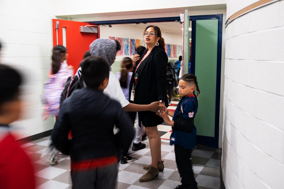 Jasibi Crews, principal of Cora Kelly, monitors students as they begin to go home after a school assembly at the end of the day.