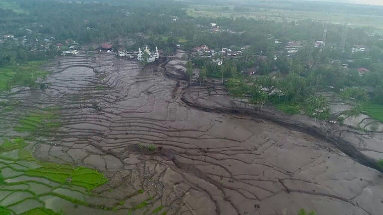Hours of heavy rain and cold lava from nearby volcano Mount Marapi inundated two districts in western Indonesia, sweeping dozens to their deaths (Handout)