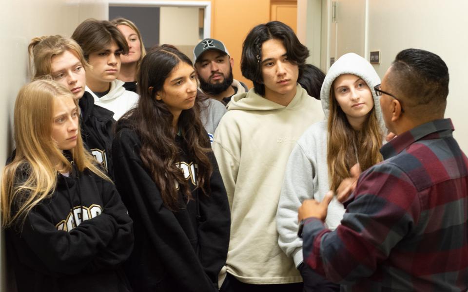 Homeboy Industries client and ex-gang member Welman Cornejo gives a tour of the Boyle Heights facility to visiting students from Palm Desert's Xavier College Preparatory High School on Dec. 12, 2022.