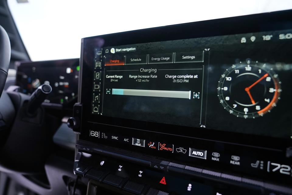 Interior view of the charging monitor on General Motors' Hummer EV as it is charged, Wednesday, Feb. 22, 2023, in Sault Ste. Marie, Mich. Some automakers and drivers fear lower battery range in the cold could limit acceptance of electric cars, trucks and buses, at a time when emissions from transportation must go down sharply to address climate change. General Motors is among those working on solutions. (AP Photo/Carlos Osorio)