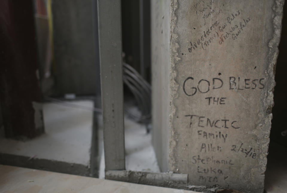 Personal notes, prayers and names are written on the incomplete walls of St. Nicholas Greek Orthodox Church and National Shrine on Thursday, July 22, 2021, in New York. The shrine will have a ceremonial lighting on the eve of the 20th anniversary of the Sept. 11, 2001 attacks, while the interior is slated for completion next year. (AP Photo/Jessie Wardarski)