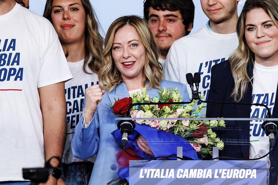 Italian Prime Minister Giorgia Meloni, center, attends the last of a three-day Brothers of Italy party conference ahead of the June elections for the European Parliament, in Pescara, Italy, Sunday, April 28, 2024. Writing on shirts and lecture stand reads in Italian "Italy changes Europe." (Roberto Monaldo/LaPresse via AP)