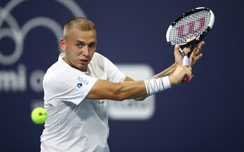 Dan Evans of Great Britain returns the ball against Malek Jaziri of Tunisia during day four of the Miami Open tennis on March 21, 2019 in Miami Gardens, Florida. - Credit: &nbsp;Getty Images