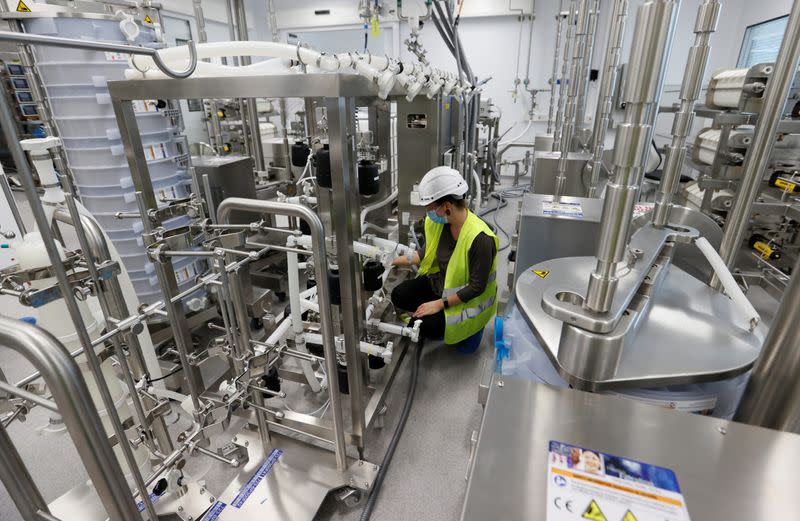 Staff member sets up an antibody production line at the Ibex building of Lonza in Visp