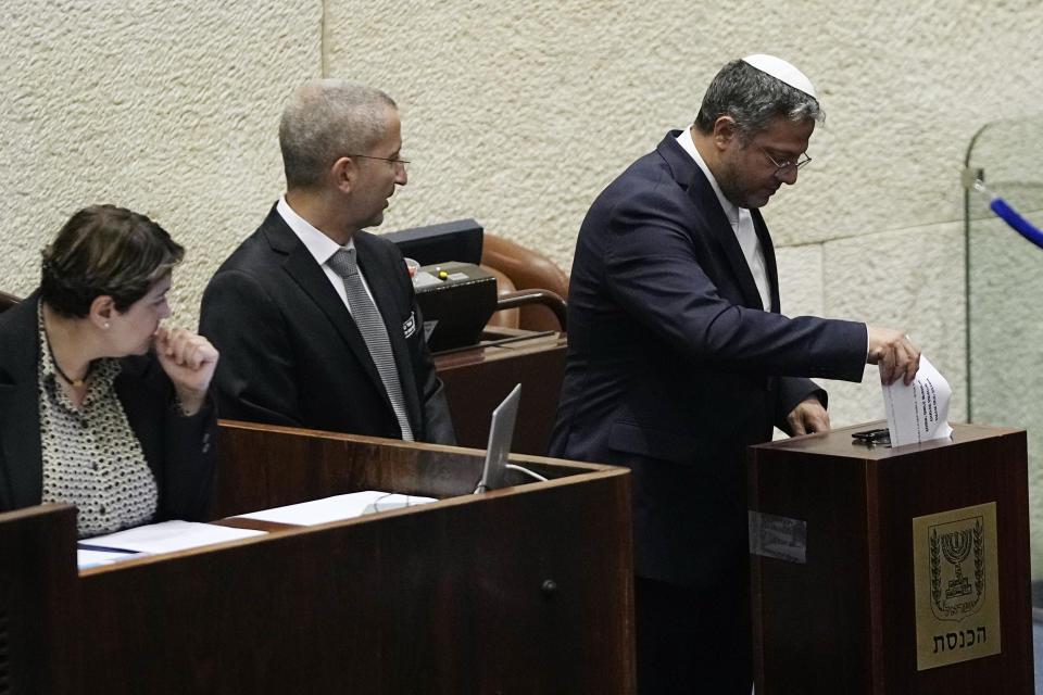 Israeli lawmaker and Minister of National Security Itamar Ben Gvir casts his vote on picking two lawmakers to serve on a judge selection panel, in the Knesset, Israel's parliament, Jerusalem, Wednesday, June 14, 2023. (AP Photo/Ohad Zwigenberg)
