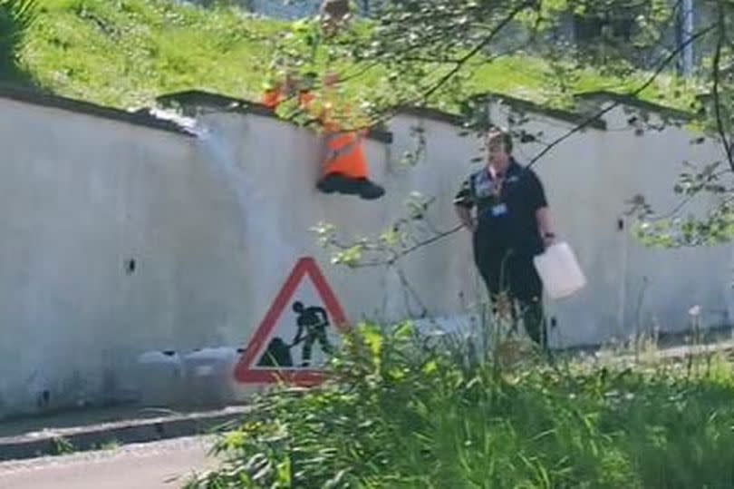 Warer being flushed out in Ocean View Drive, Brixham, on May 20