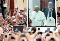 Pope Francis greets faithfuls as he travels in the popemobile through Cartagena, Colombia, September 10, 2017. REUTERS/Federico Rios