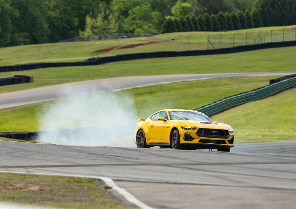 Formula Drift champion Vaughn Gittin Jr., seen here April 24, 2023 at the Virginia International Raceway in Alton, teaches his mom, Dawn, how to drift the 2024 Ford Mustang. They taped a Ford video airing on YouTube that celebrates Mother's Day while showing driving tips to novice drivers who may want to go to the track one day.