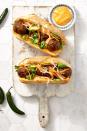 <p>This Asian riff on a classic Italian sub is on fire thanks to an easy homemade sriracha mayo.</p><p><em><a href="https://www.goodhousekeeping.com/food-recipes/a39934/sriracha-meatball-hoagies-recipe/" rel="nofollow noopener" target="_blank" data-ylk="slk:Get the recipe for Sriracha Meatball Hoagies »;elm:context_link;itc:0;sec:content-canvas" class="link "><span class="redactor-invisible-space">Get the recipe for Sriracha Meatball Hoagies »</span> </a></em></p>