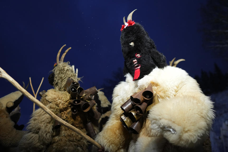 Revelers depicting devils take part in a traditional St Nicholas procession near the village of Lidecko, Czech Republic, Sunday, Dec. 3, 2023. This pre-Christmas tradition has survived for centuries in a few villages in the eastern part of the country. (AP Photo/Petr David Josek)