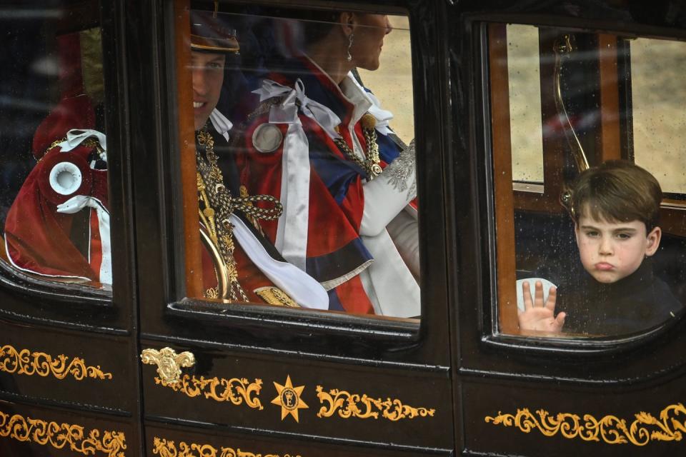 london, england may 06 prince william, prince of wales, catherine, princess of wales and prince louis of wales travel back to buckingham palace following the coronation of king charles iii and queen camilla at westminster abbey on may 6, 2023 in london, england the coronation of charles iii and his wife, camilla, as king and queen of the united kingdom of great britain and northern ireland, and the other commonwealth realms takes place at westminster abbey today charles acceded to the throne on 8 september 2022, upon the death of his mother, elizabeth ii photo by sebastien bozon wpa poolgetty images