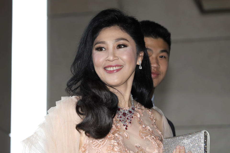 Former Thai Prime Minister Yingluck Shinawatra arrives at the wedding of her niece Paetongtarn "Ing" Shinawatra at a hotel in Hong Kong, Friday, March 22, 2019. (AP Photo/Kin Cheung)