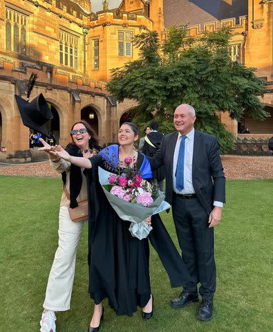 <p>Courtesy Ali Moore</p> Ali Moore with her parents during law school graduation.