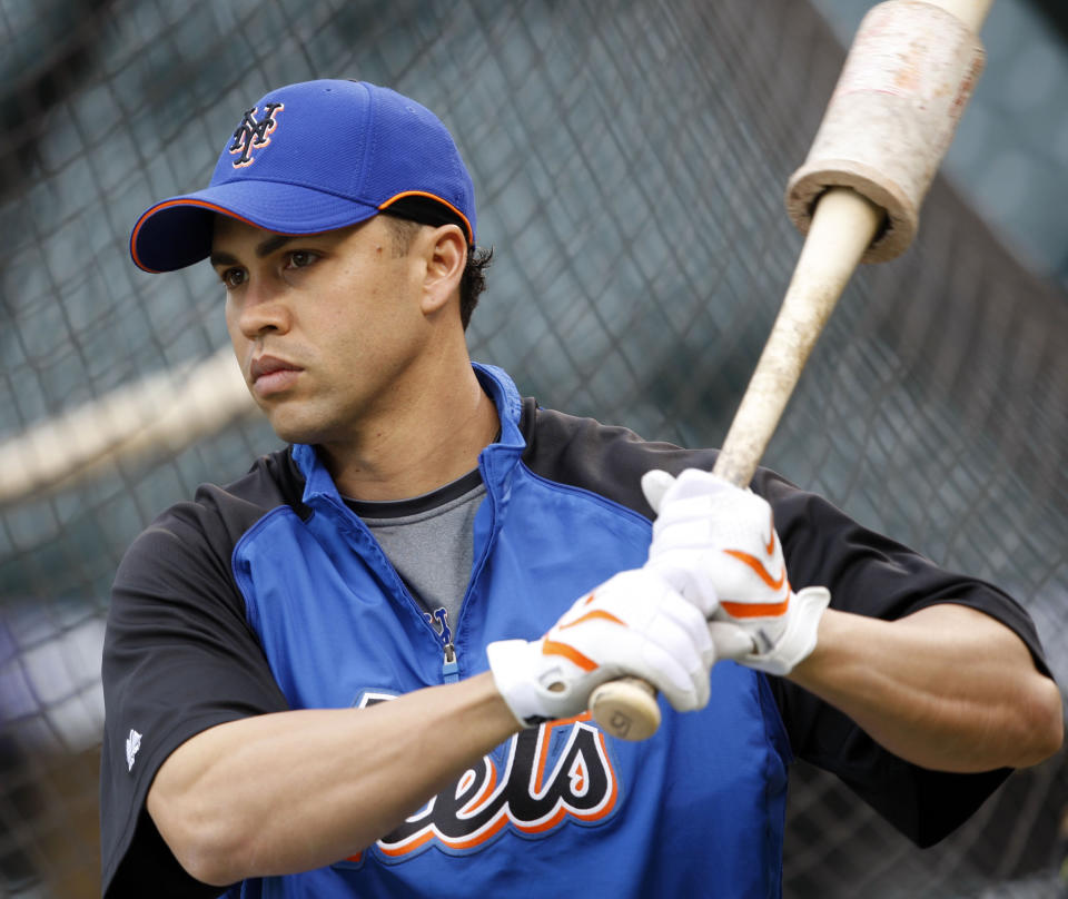 FILE - In this Friday, May 23, 2008 file photo, New York Mets outfielder Carlos Beltran waits to bat before facing the Colorado Rockies in the first inning of a baseball game in Denver. A person familiar with the decision tells The Associated Press the New York Mets have decided to hire Carlos Beltrán as their manager. The person spoke on condition of anonymity Friday, Nov. 1, 2019 because the team has not made an announcement. (AP Photo/David Zalubowski, File)