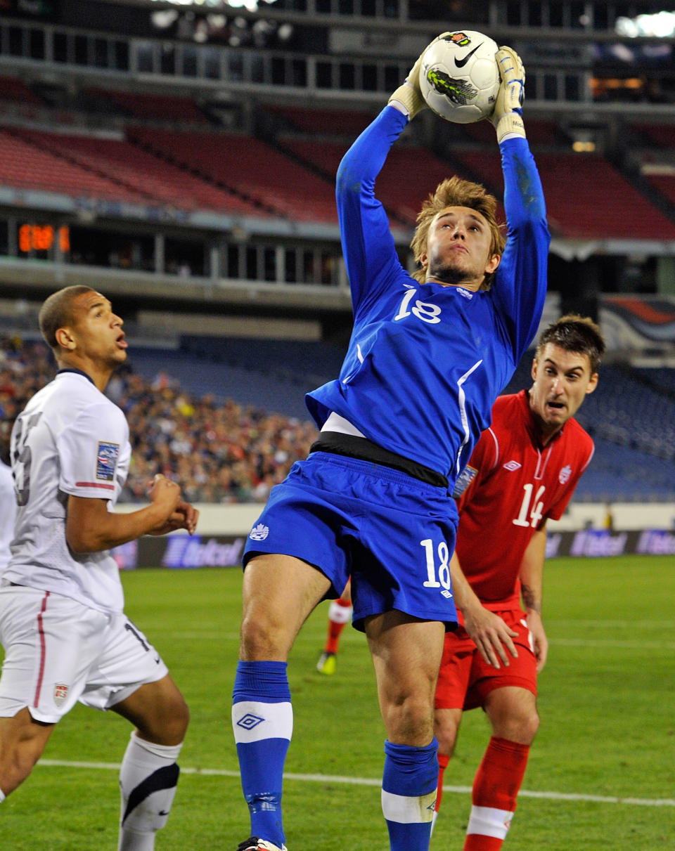 NASHVILLE, TN - MARCH 24: Goalkeeper Michal Misiewicz #18 of Canada jumps to make a save against the USA in a 2012 CONCACAF Men's Olympic Qualifying match at LP Field on March 24, 2012 in Nashville, Tennessee. (Photo by Frederick Breedon/Getty Images)