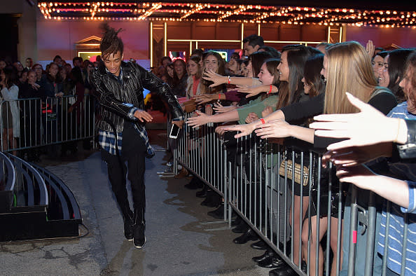 Jaden Smith, wearing a flannel shirt and leather jacket, pumped up the crowd 