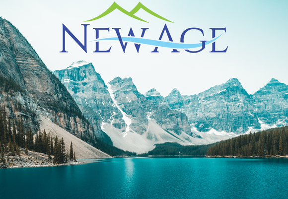 Glacial lake in front of snowy mountains with New Age logo in the sky