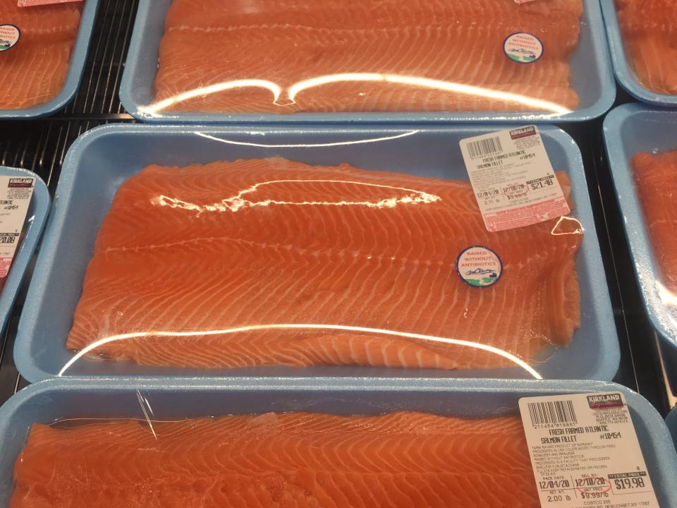 packs of salmon in blue package wrapped in plastic