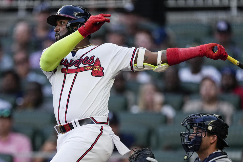Atlanta Braves designated hitter Marcell Ozuna watches his double against the New York Yankees during the second inning of a baseball game Wednesday, Aug. 16, 2023, in Atlanta. (AP Photo/John Bazemore)