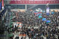 Passengers wait to board trains at Shanghai Hongqiao railway station ahead of the five-day Labour Day holiday, in Shanghai