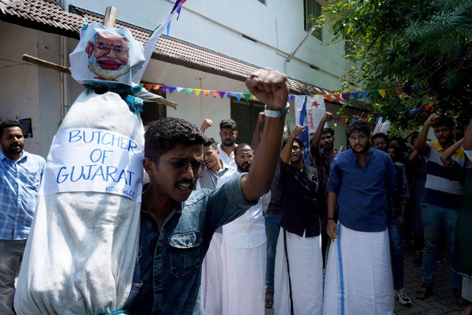 Students protest on Jan. 25, 2023, with an effigy of Indian Prime Minister Narendra Modi after watching the BBC documentary "India: The Modi Question" in Kochi.