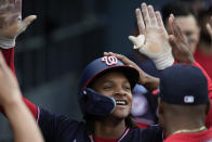 Washington Nationals' CJ Abrams (5) celebrates in the dugout after hitting a home run during the second inning of a baseball game against the Los Angeles Dodgers in Los Angeles, Wednesday, May 31, 2023. (AP Photo/Ashley Landis)