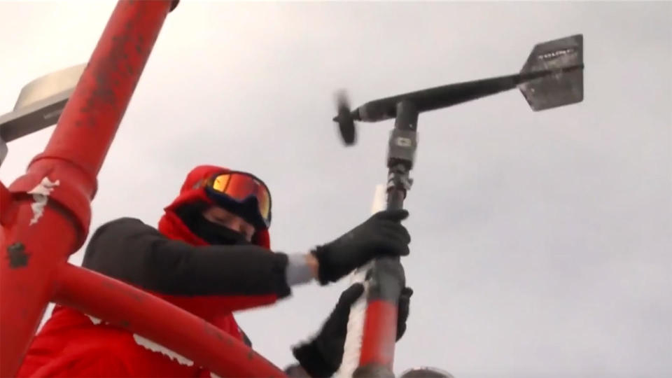 Checking weather instruments at Mount Washington Observatory, New Hampshire's highest peak. / Credit: CBS News