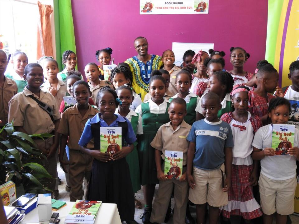 Juleus Ghunta launching his children's book in his hometown of Jamaica.