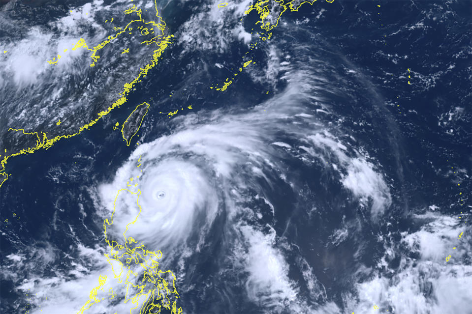 This satellite image taken by Himawari-8, a Japanese weather satellite, and provided by National Institute of Information and Communications Technology, shows Typhoon Doksuri near the northern Philippines Tuesday, July 25, 2023. (Courtesy of National Institute of Information and Communications Technology (NICT) via AP)
