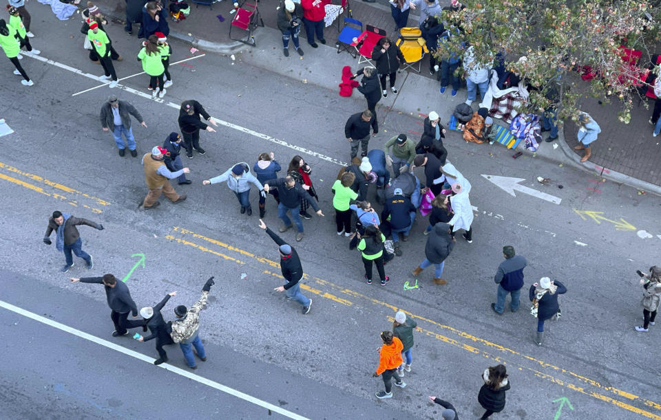 Personnel rush to where a person was injured during the Raleigh Christmas Parade on Hillsborough Street in Raleigh, N.C., Saturday, Nov. 19, 2022. Witnesses say people attending the Raleigh Christmas Parade heard the truck's driver screaming that he had lost control of the vehicle and couldnâ€™t stop it before the crash.( (Ethan Hyman/The News & Observer via AP) / Credit: Ethan Hyman / AP