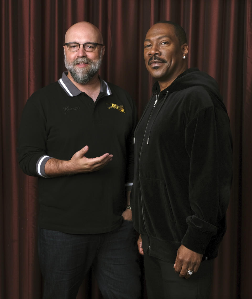 This Sept. 7, 2019 photo shows Eddie Murphy, right, star of the film "Dolemite Is My Name," with director Craig Brewer at the Shangri-La Hotel during the Toronto International Film Festival in Toronto. (Photo by Chris Pizzello/Invision/AP)