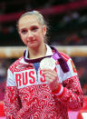Victoria Komova of Russia poses with her silver medal after the Artistic Gymnastics Women's Individual All-Around final on Day 6 of the London 2012 Olympic Games at North Greenwich Arena on August 2, 2012 in London, England. (Photo by Ronald Martinez/Getty Images)