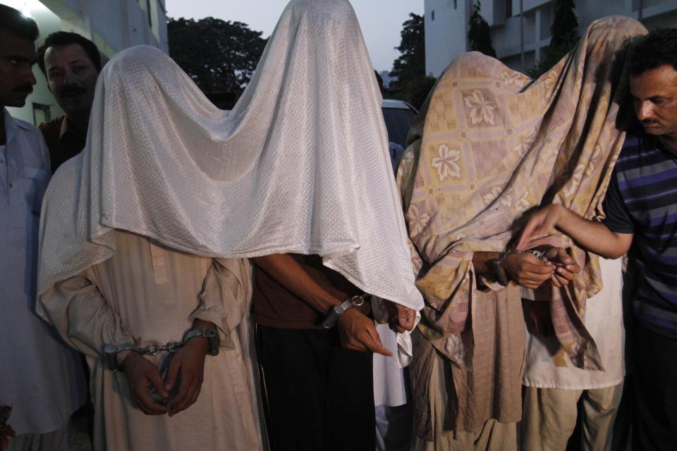 FILE - Suspected militants allegedly associated with the Tehreek-e-Taliban arrive before a media with their faces covered in Karachi, Pakistan on Thursday, May 12, 2011. The Pakistani Taliban, also known as Tehreek-e-Taliban Pakistan, or TTP, claimed responsibility for the Jan. 30, 2023 deadly suicide bombing at a mosque inside a police compound in the northwestern city of Peshawar, in one of the deadliest attacks on security forces in recent months. (AP Photo/Shakil Adil, file)