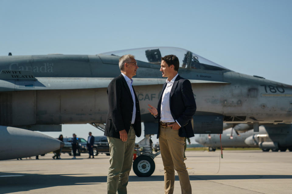 Canada's Prime Minister Justin Trudeau speaks with NATO Secretary General Jens Stoltenberg near a Canadian Forces CF-18 Hornet fighter aircraft during their visit to CFB Cold Lake in Cold Lake, Alberta, Canada August 26, 2022.  Adam Scotti/Prime Minister's Office/Handout via REUTERS  THIS IMAGE HAS BEEN SUPPLIED BY A THIRD PARTY.