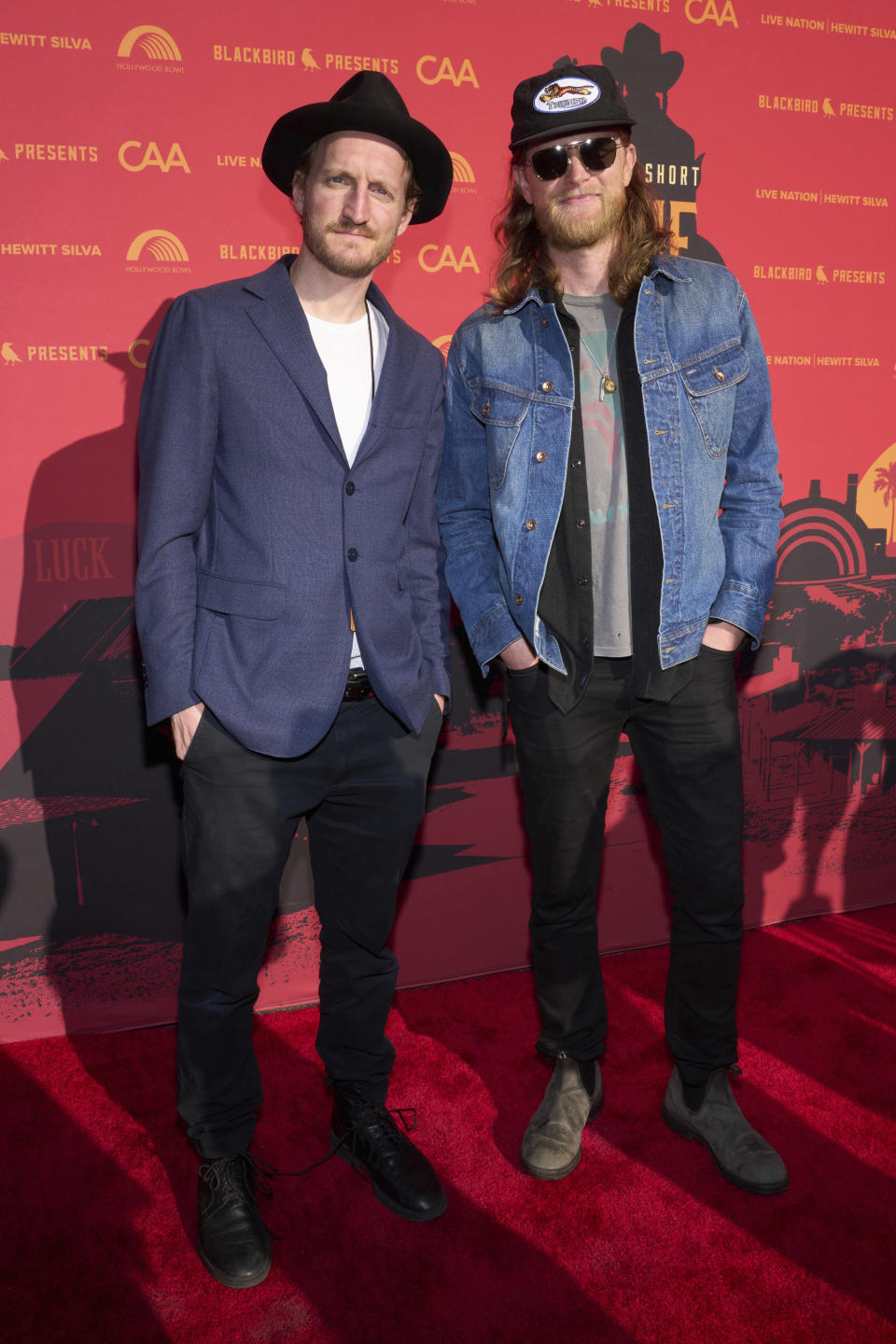 Jeremiah Fraites, left, and Wesley Schultz of The Lumineers arrive at Willie Nelson 90, celebrating the singer's 90th birthday on Saturday, April 29, 2023, at the Hollywood Bowl in Los Angeles. (Photo by Allison Dinner/Invision/AP)