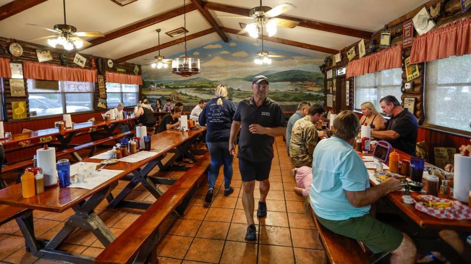 The dining room at Shiver’s Bar-B-Q features long, communal-style tables in a homey atmosphere.