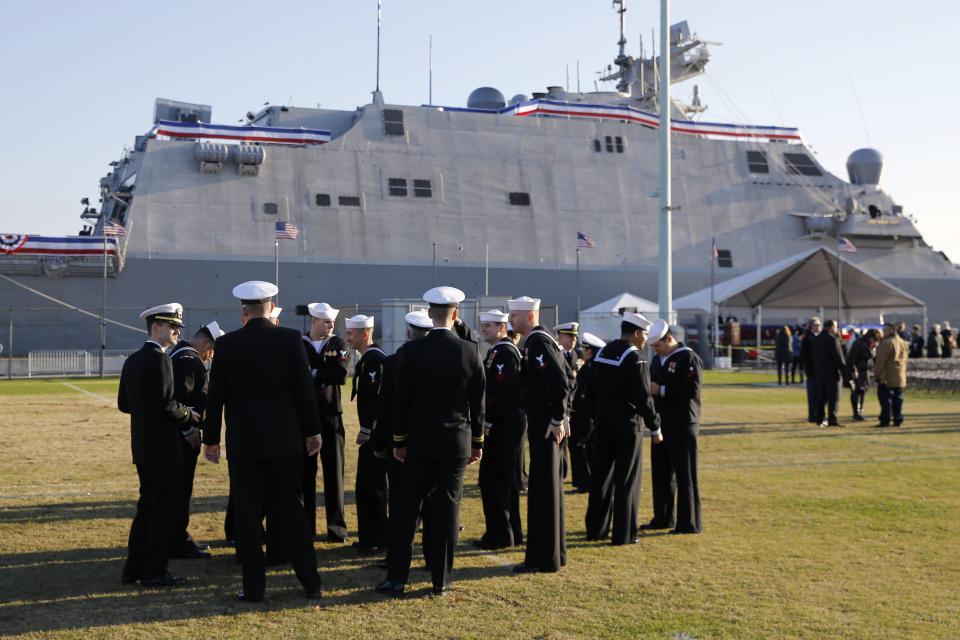 FILE - Crew members of the USS Sioux City, a Freedom-class of littoral combat ship, gather before the ship's commissioning ceremony, Saturday, Nov. 17, 2018, at the U.S. Naval Academy in Annapolis, Md. The Navy that once wanted smaller, speedy warships to chase down pirates has made a speedy pivot to Russia and China and many of those ships, like the USS Sioux City, could be retired. The Navy wants to decommission nine ships in the Freedom-class, warships that cost about $4.5 billion to build. (AP Photo/Patrick Semansky, File)