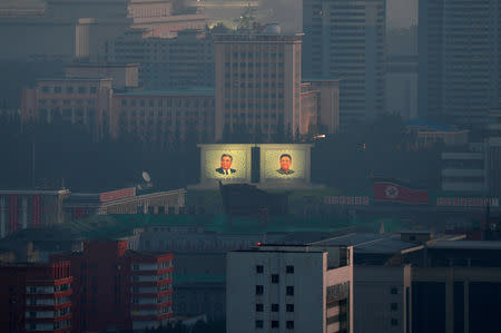 Portraits of late North Korean leaders Kim Il Sung and Kim Jong Il are seen early morning at a memorial park in Pyongyang, North Korea, September 8, 2018. REUTERS/Danish Siddiqui