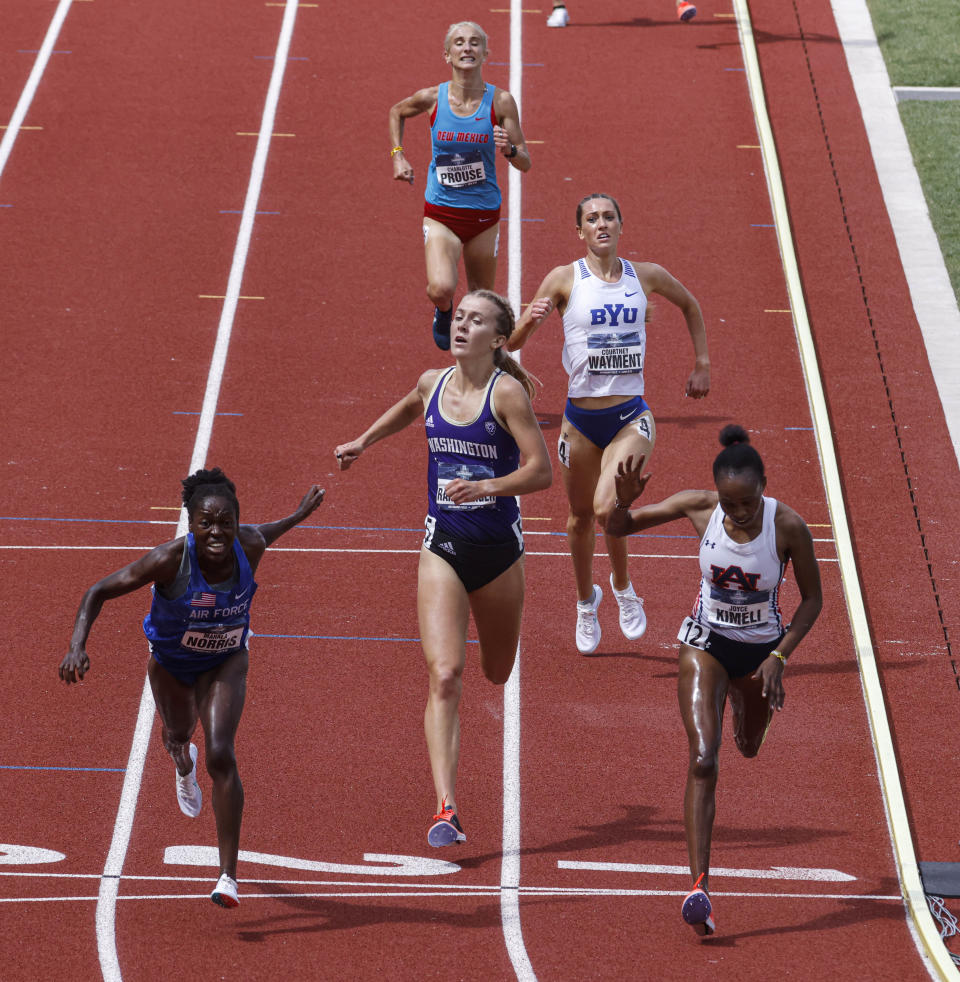 Air Force's Mahala Norris, left, narrowly edges out Auburn's Joyce Kimeli in the women's steeplechase during the NCAA Division I Outdoor Track and Field Championships, Saturday, June 12, 2021, at Hayward Field in Eugene, Ore. (AP Photo/Thomas Boyd)