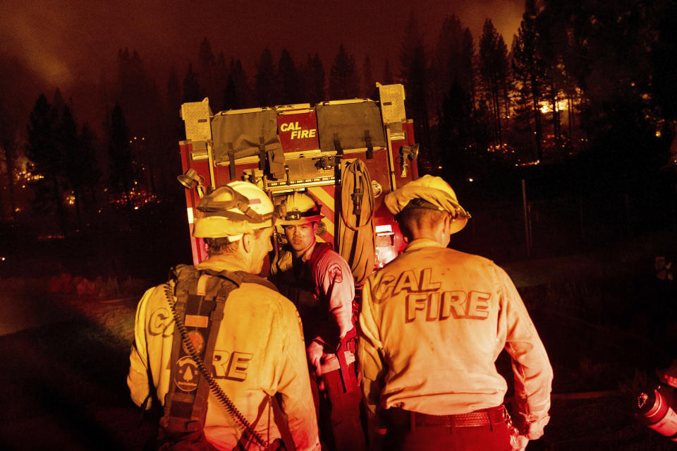 Firefighters work to stop the Sugar Fire, part of the Beckwourth Complex Fire, from spreading near Frenchman Lake in Plumas National Forest, Calif., on Thursday, July 8, 2021. (AP Photo/Noah Berger)