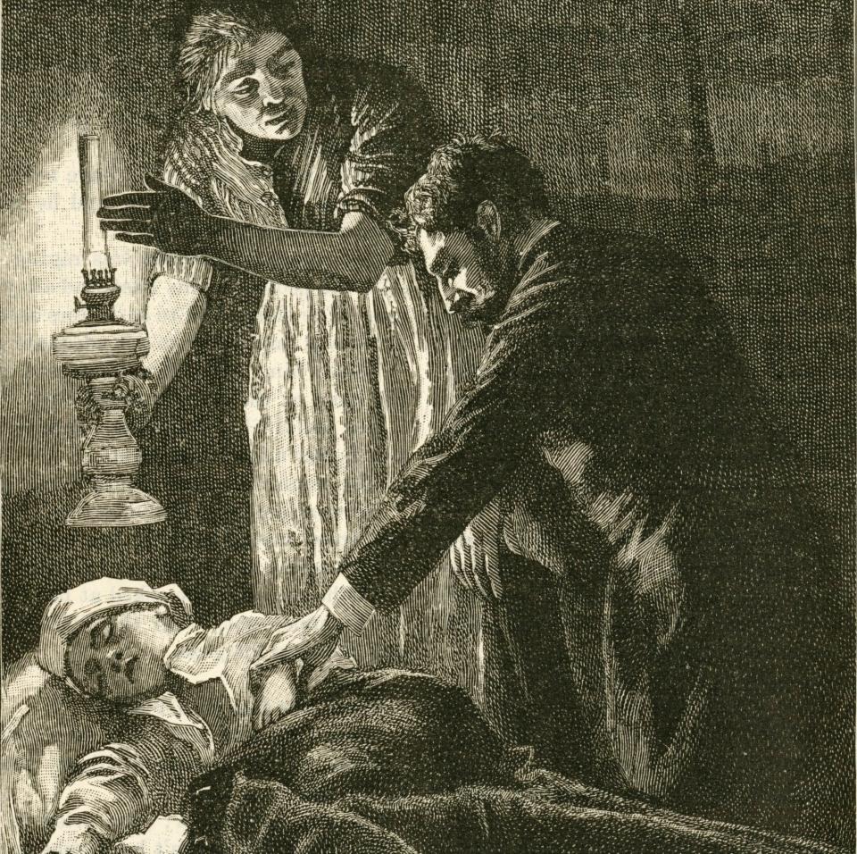 'Mother in a poor district of London holding an oil lamp so doctor can examine her child, only to be told that it has died from Influenza - World History Archive / TopFoto