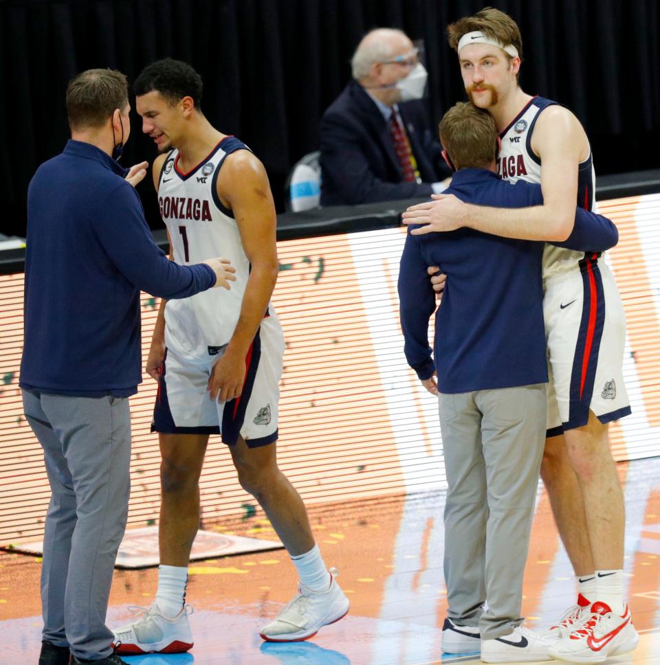 Gonzaga Bulldogs guard Jalen Suggs (1) and Gonzaga Bulldogs forward Drew Timme (2) walk off the court after losing to Baylor during the championship game.