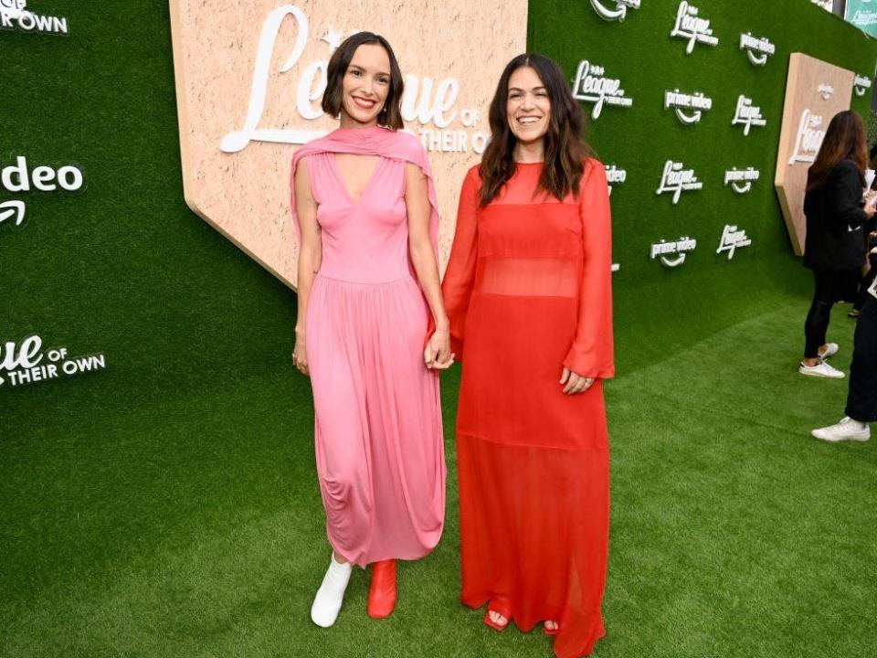 Jodi Balfour and Abbi Jacobson hold hands at the premiere of &quot;A League Of Their Own&quot;