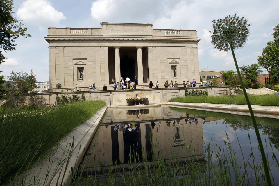 People walk around the renovated gardens and exterior of the Rodin Museum on Wednesday, May 16, 2012, in Philadelphia. After a three-year renovation, the museum is scheduled to reopen to the public on July 13. (AP Photo/Alex Brandon)