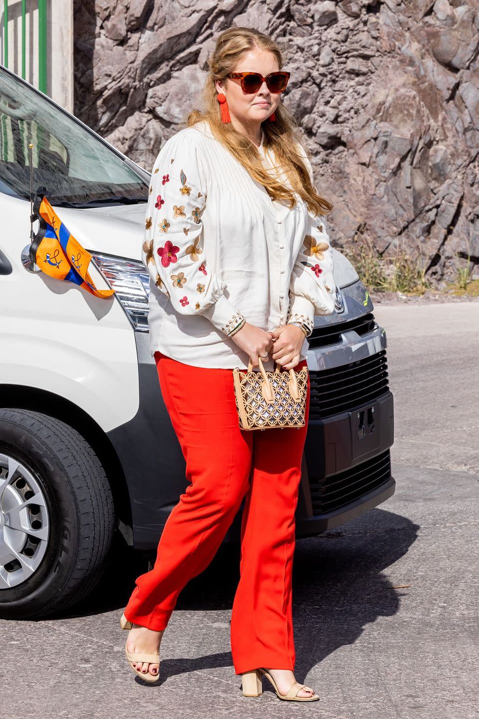 a woman in red pants